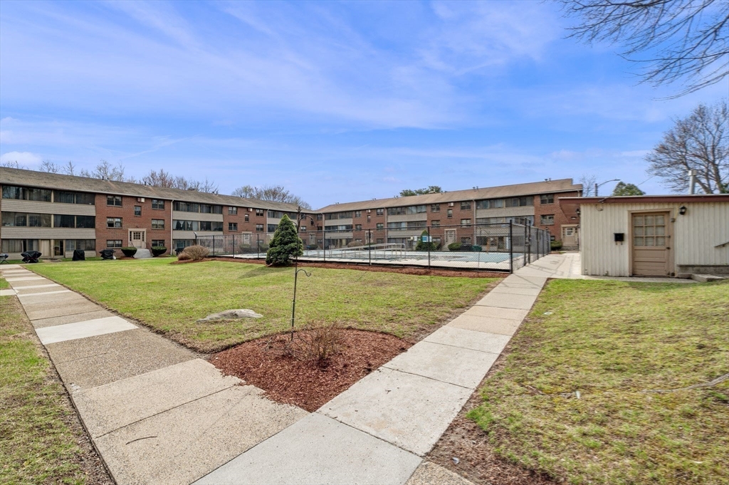 68 Preston Street, Unit 9D Wakefield, MA 01880 - Photo 25 of 29 a view of a swimming pool with a yard