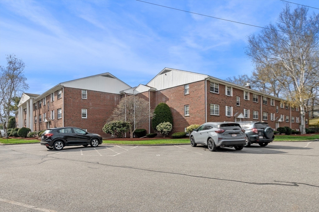 68 Preston Street, Unit 9D Wakefield, MA 01880 - Photo 27 of 29 a car parked in front of a building