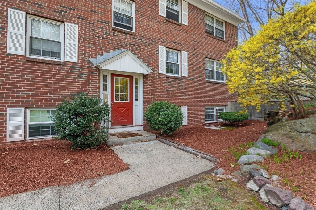 68 Preston Street, Unit 9D Wakefield, MA 01880 - Photo 28 of 29 a front view of a house with garden