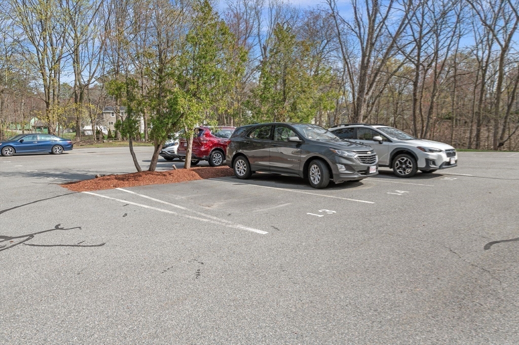68 Preston Street, Unit 9D Wakefield, MA 01880 - Photo 29 of 29 a view of a cars parked on the side of a street