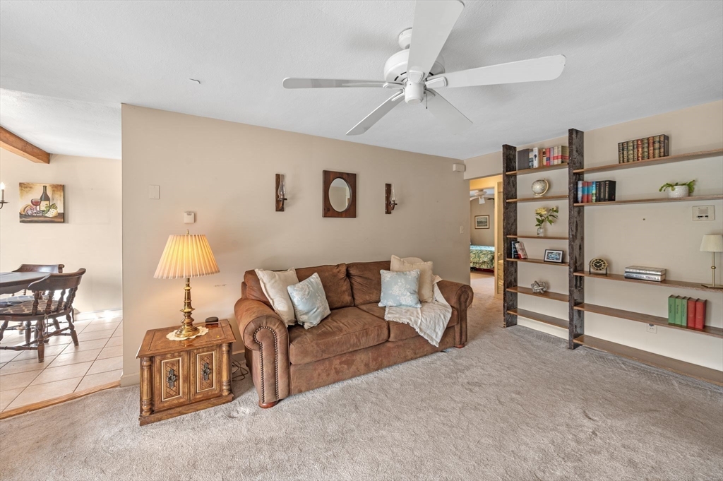 68 Preston Street, Unit 9D Wakefield, MA 01880 - Photo 6 of 29 a living room with furniture and a lamp