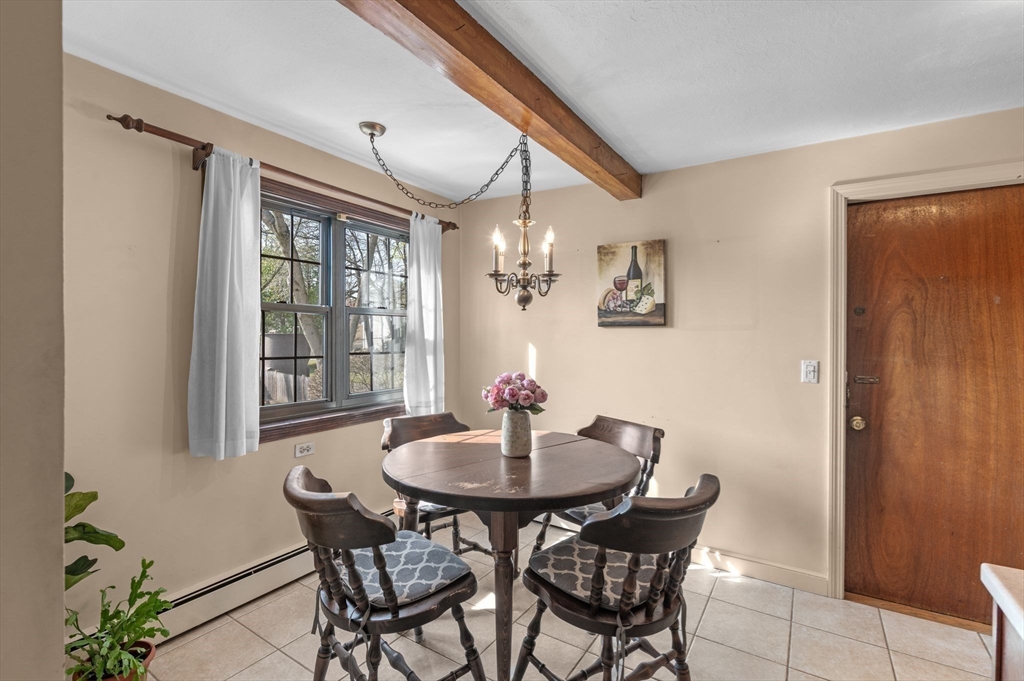 68 Preston Street, Unit 9D Wakefield, MA 01880 - Photo 7 of 29 a dining room with furniture and window