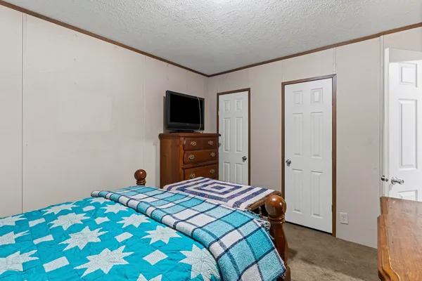 a view of a workspace with furniture and a living room