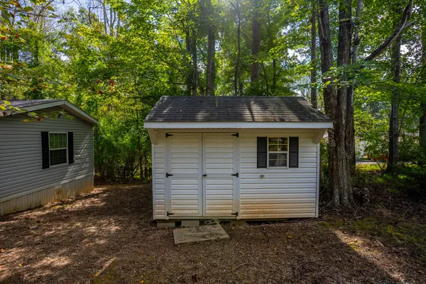 a view of stairs with a small yard