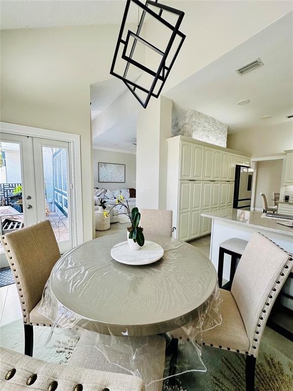 784 South Pennsylvania Avenue Winter Park, FL 32789 - Photo 15 of 29 a dining room with furniture and wooden floor