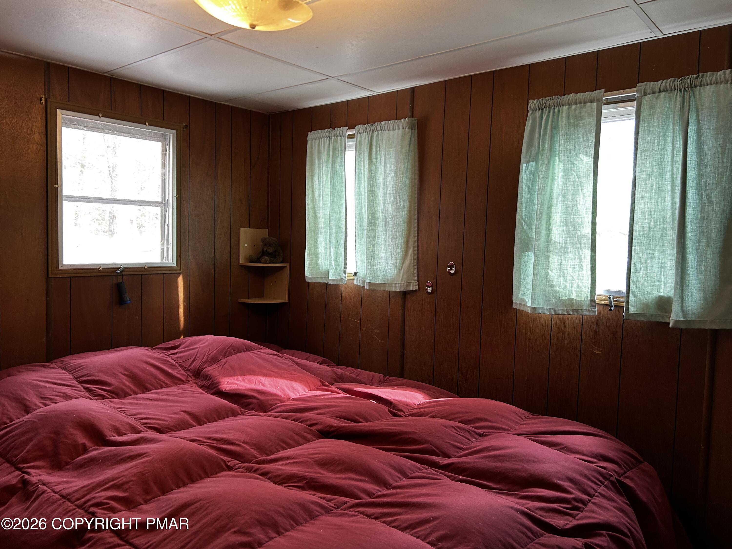 255 Buck Fever Trail Scotrun, PA 18355 - Photo 13 of 27 a bedroom with a bed and window