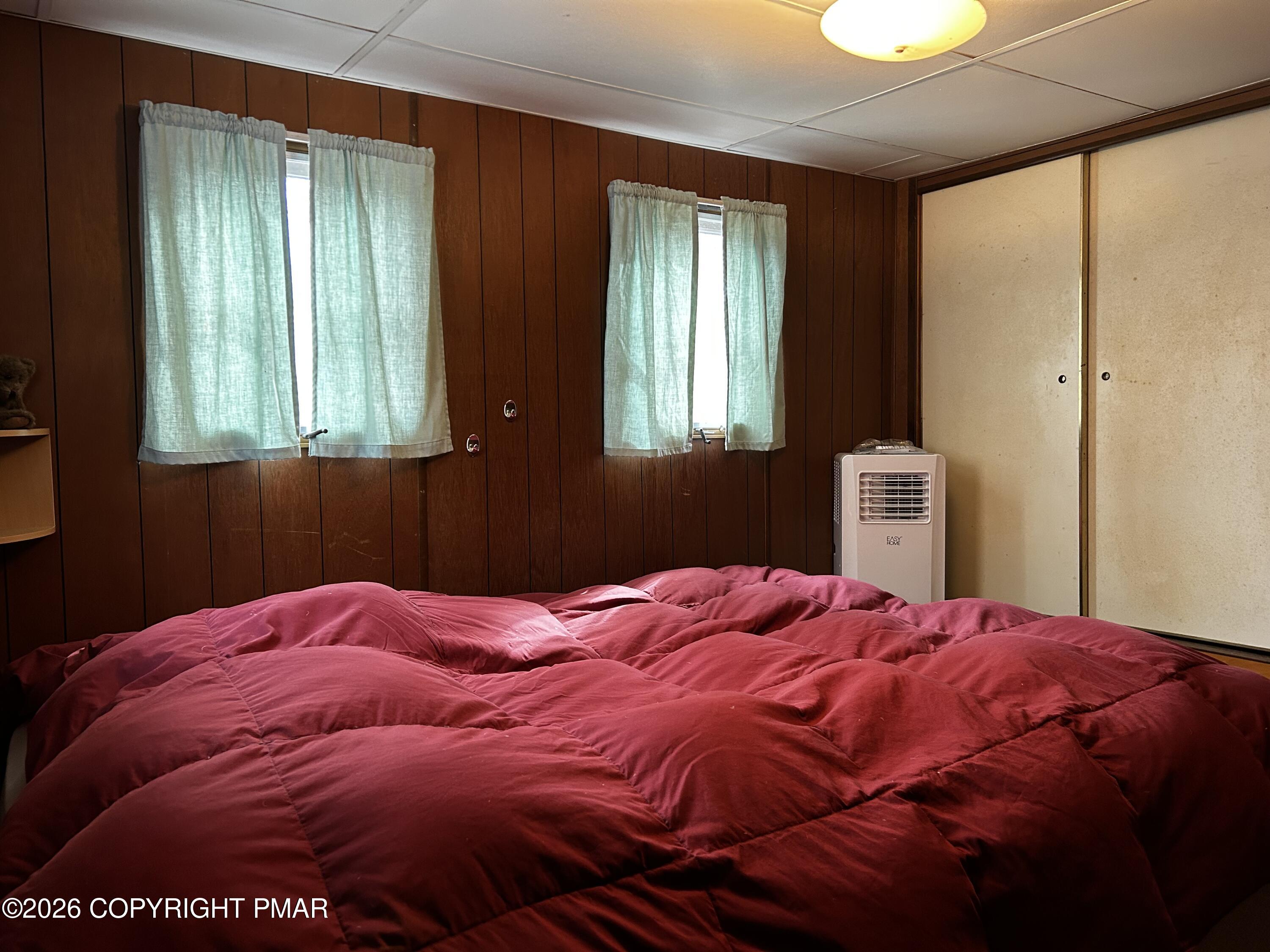 255 Buck Fever Trail Scotrun, PA 18355 - Photo 14 of 27 a bedroom with a bed and window