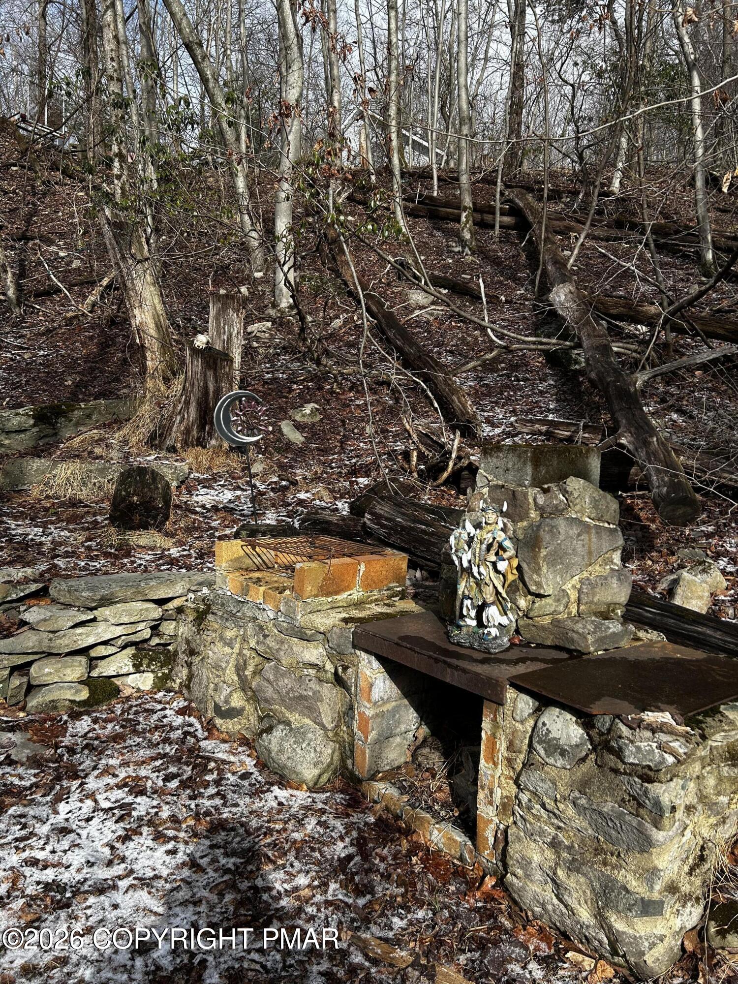 255 Buck Fever Trail Scotrun, PA 18355 - Photo 17 of 27 a view of a water fountain and a tree