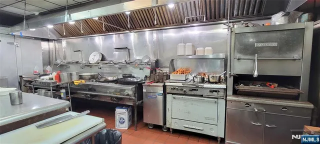a kitchen with a stove and cabinets
