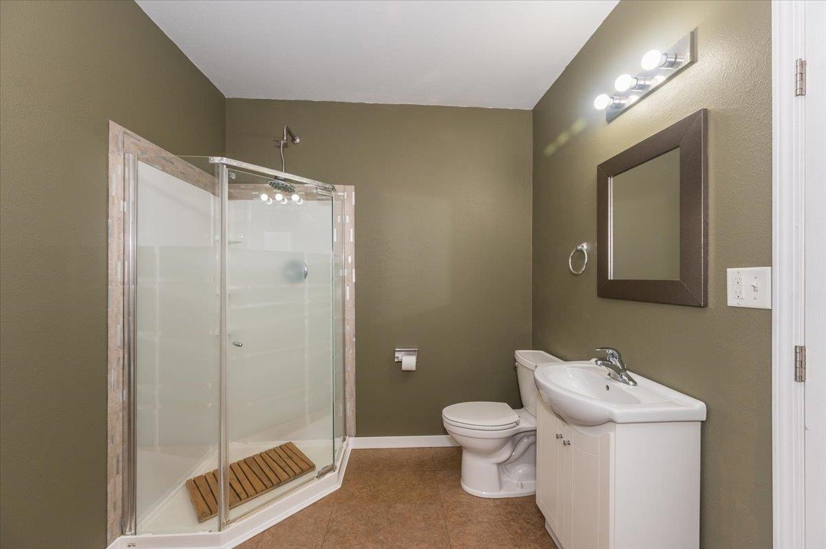 3701 East 2nd Street Superior, WI 54880 - Photo 9 of 25 Full bath featuring a stall shower, vanity, and tile patterned floors