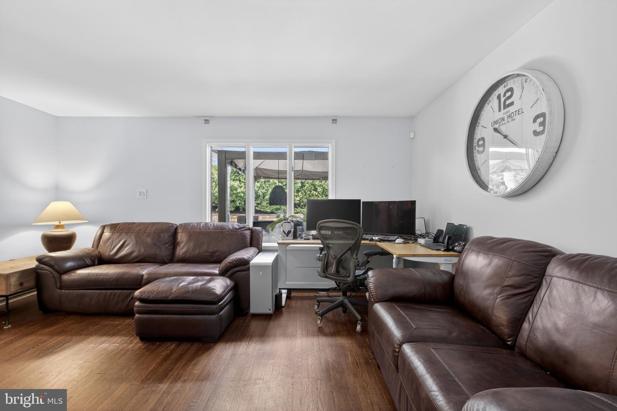 216 Revere Road Marlton, NJ 08053 - Photo 2 of 47 a living room with furniture a clock on wall and a window