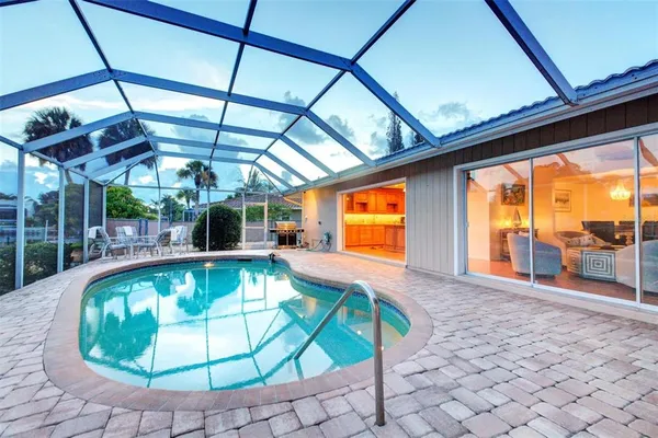 a view of a swimming pool with a porch