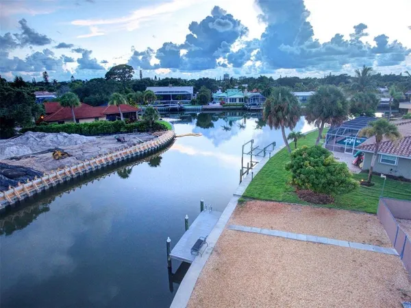 a view of a lake with a house in the background