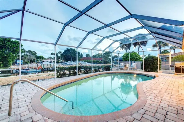a view of a swimming pool with a porch