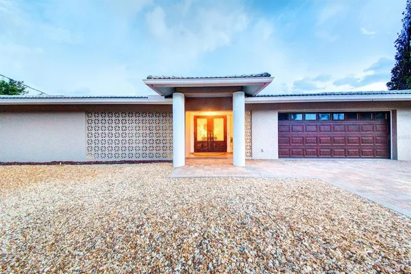 front view of a house with a large window