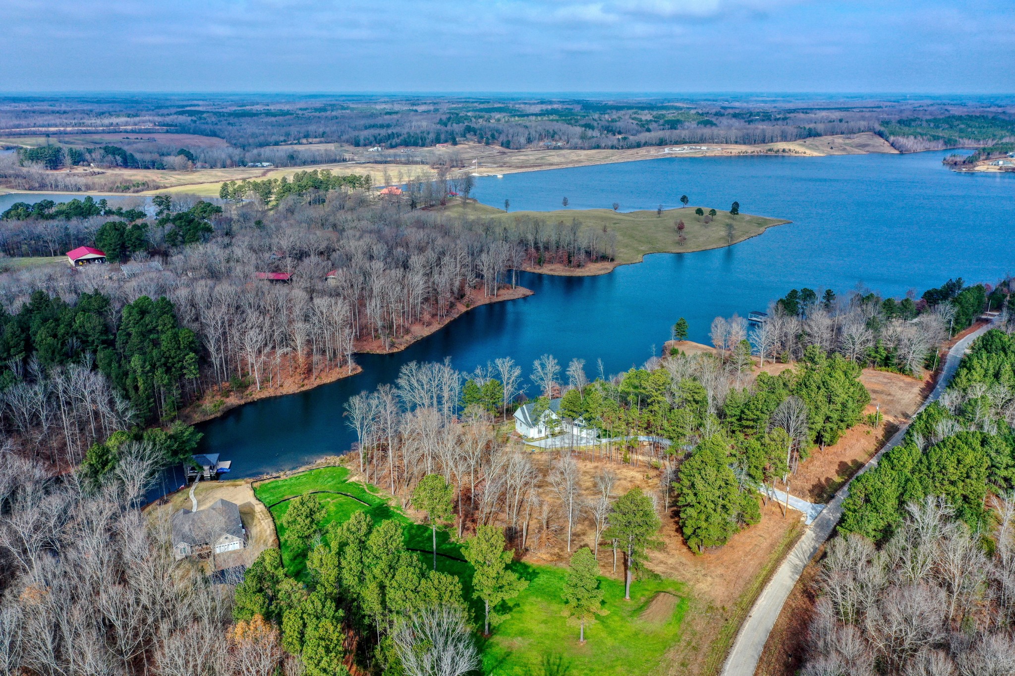 a view of a lake with a yard