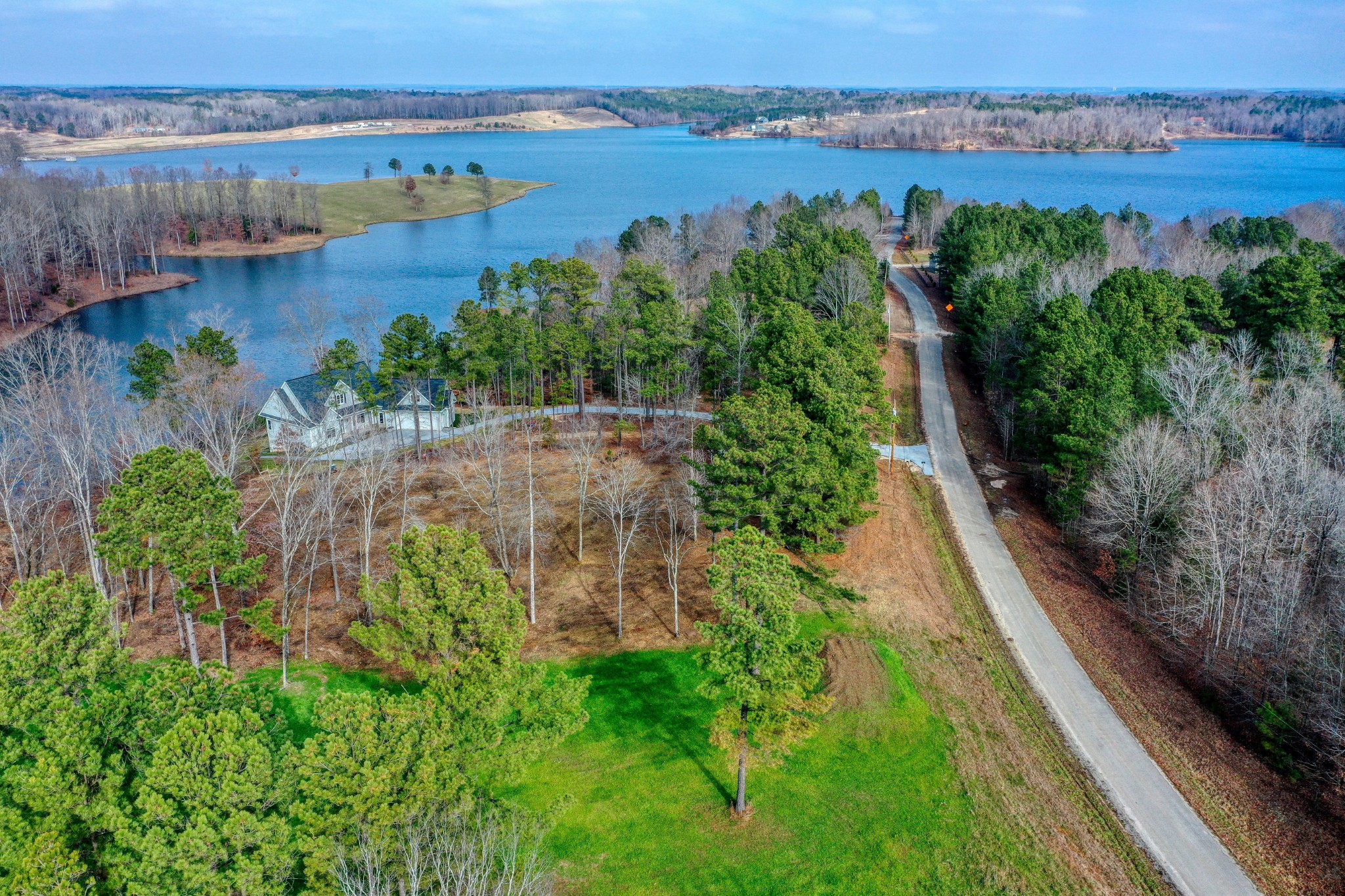 0 Reedy Creek Road Huntingdon, TN 38344 - Photo 2 of 16 an aerial view of green landscape with trees houses and lake view