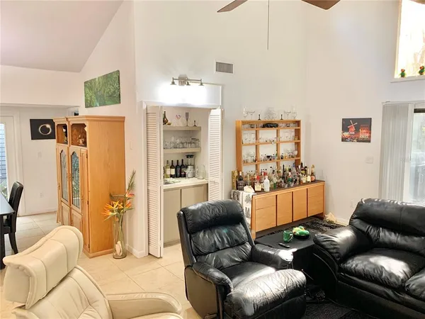 a living room with furniture and a large window