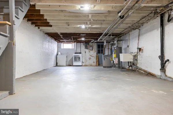 a view of storage and utility room with stairs