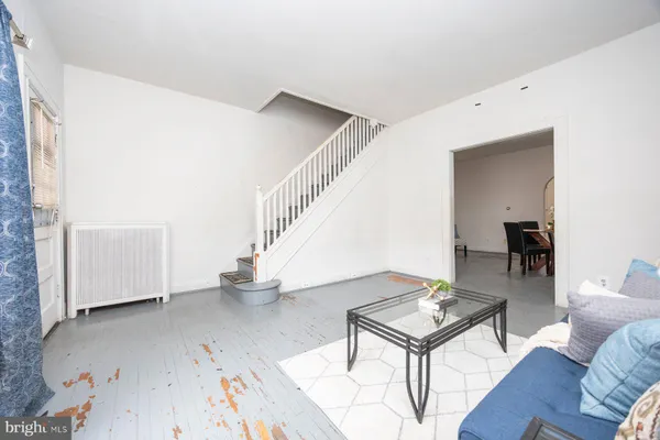 a living room with furniture and a table