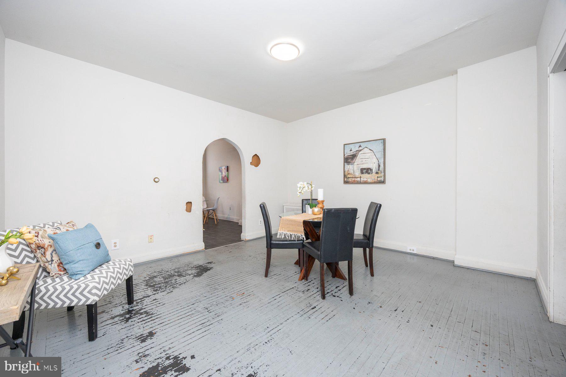 3237 Dudley Avenue Baltimore, MD 21213 - Photo 5 of 16 a view of a dining room with furniture and wooden floor