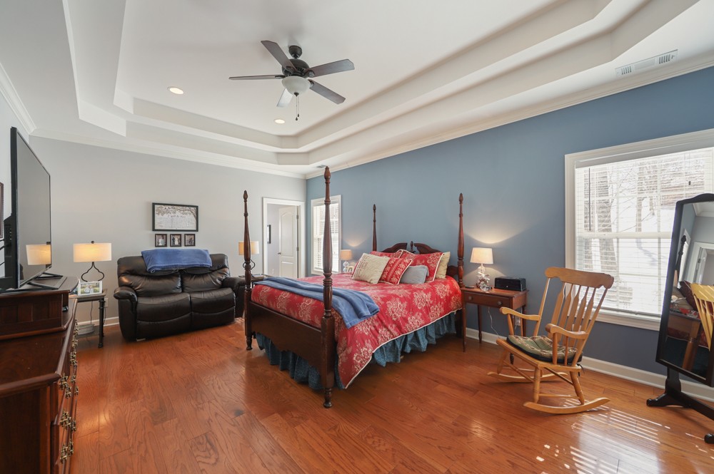706 Deer Ridge Lane Lebanon, TN 37087 - Photo 14 of 29 a bedroom with a bed wooden floor and window