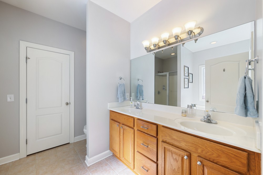 706 Deer Ridge Lane Lebanon, TN 37087 - Photo 16 of 29 a bathroom with a double vanity sink and a mirror