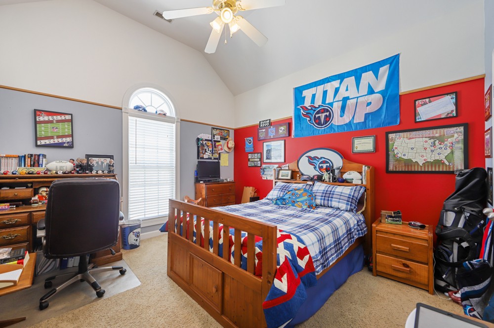 706 Deer Ridge Lane Lebanon, TN 37087 - Photo 19 of 29 a bedroom with a bed and a bookshelf in it
