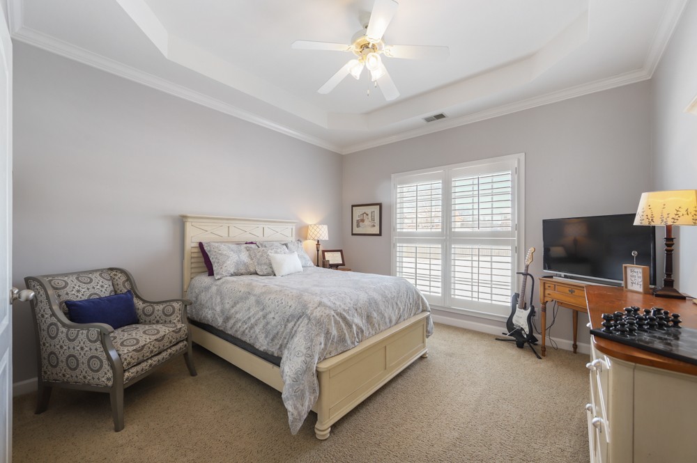 706 Deer Ridge Lane Lebanon, TN 37087 - Photo 20 of 29 a bedroom with a bed couch and a flat tv screen