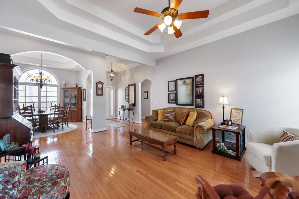 706 Deer Ridge Lane Lebanon, TN 37087 - Photo 7 of 29 a living room with furniture and a chandelier