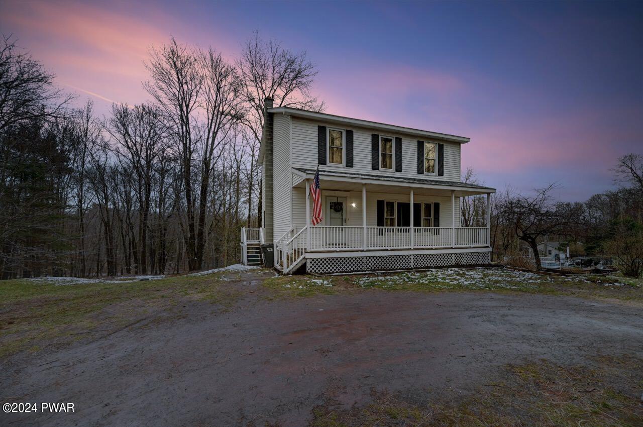 19 Ripple Lane Beach Lake, PA 18405 - Photo 3 of 52 a front view of a house with a garden