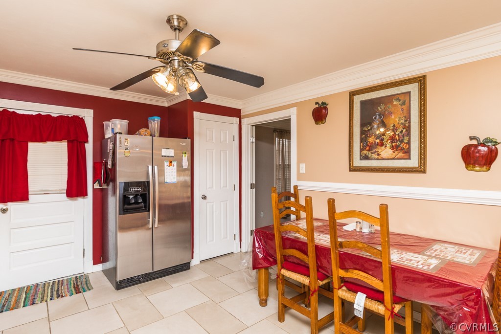 11301 Rolling Brook Road Chester, VA 23831 - Photo 11 of 49 a dinning room with chandelier fan and a dining table