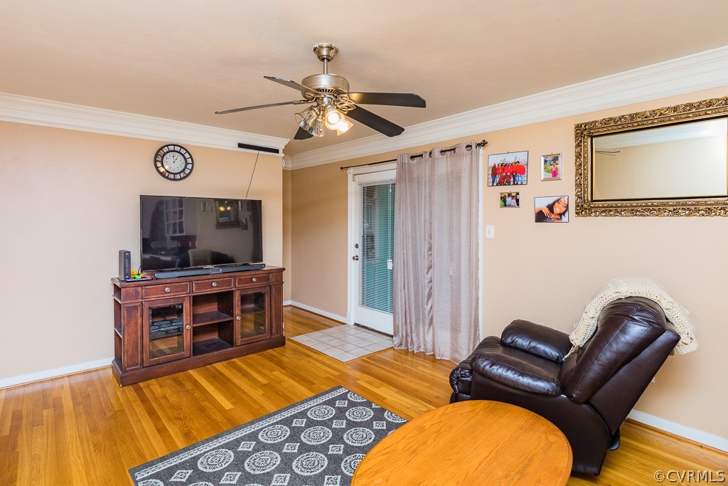 11301 Rolling Brook Road Chester, VA 23831 - Photo 15 of 49 a living room with furniture and a flat screen tv