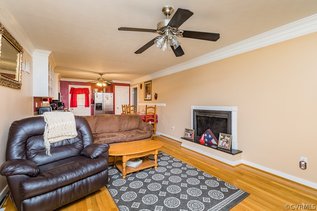 11301 Rolling Brook Road Chester, VA 23831 - Photo 17 of 49 a living room with furniture and a fireplace