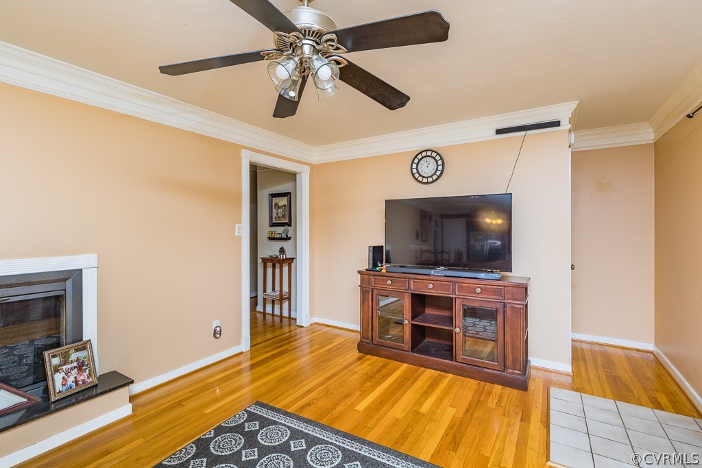 11301 Rolling Brook Road Chester, VA 23831 - Photo 18 of 49 a living room with furniture and a flat screen tv
