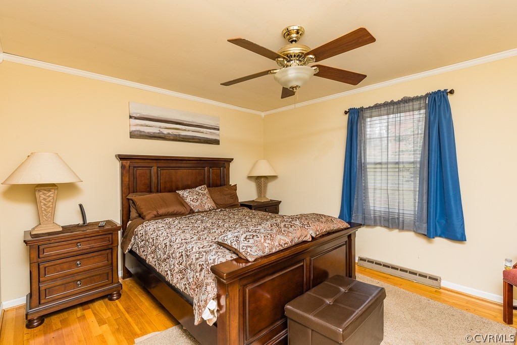 11301 Rolling Brook Road Chester, VA 23831 - Photo 27 of 49 a bedroom with a bed and a chandelier