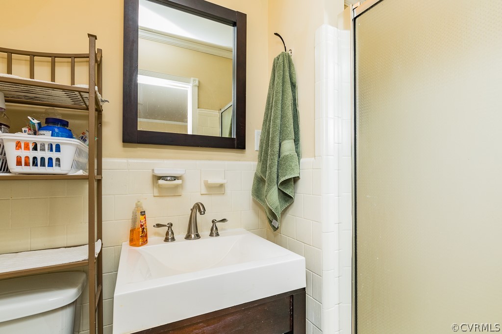 11301 Rolling Brook Road Chester, VA 23831 - Photo 29 of 49 a bathroom with a sink and a mirror
