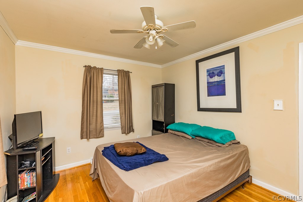 11301 Rolling Brook Road Chester, VA 23831 - Photo 31 of 49 a bedroom with a bed and a flat screen tv