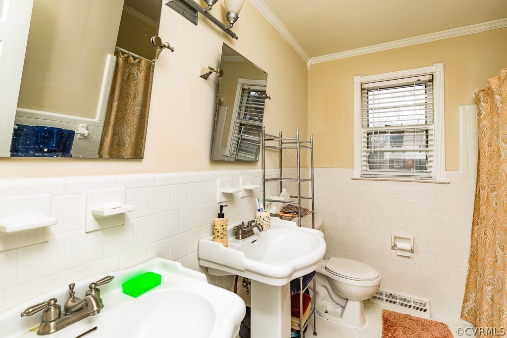 11301 Rolling Brook Road Chester, VA 23831 - Photo 33 of 49 a bathroom with a sink a toilet and a mirror