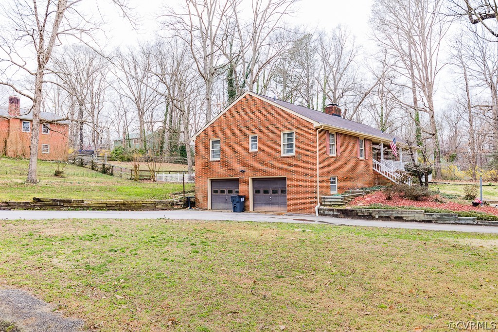 11301 Rolling Brook Road Chester, VA 23831 - Photo 4 of 49 a front view of a house with a yard