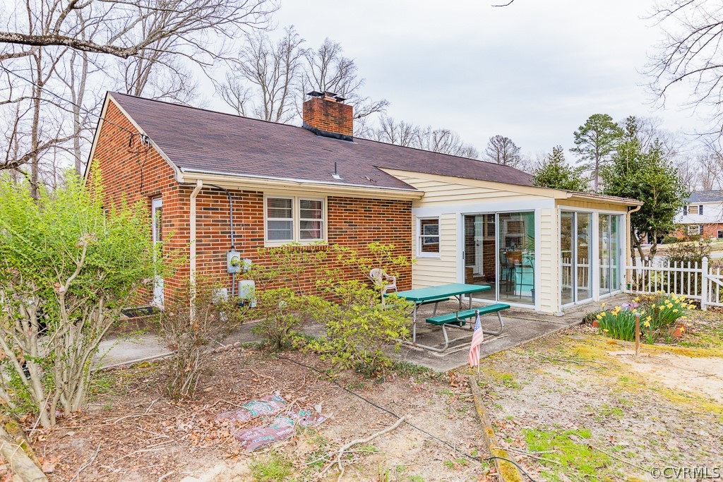 11301 Rolling Brook Road Chester, VA 23831 - Photo 44 of 49 a brick house with a small yard and potted plants