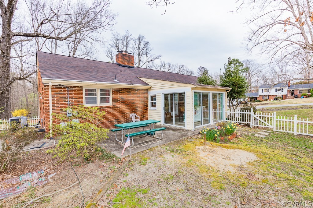 11301 Rolling Brook Road Chester, VA 23831 - Photo 5 of 49 a backyard of a house with outdoor seating