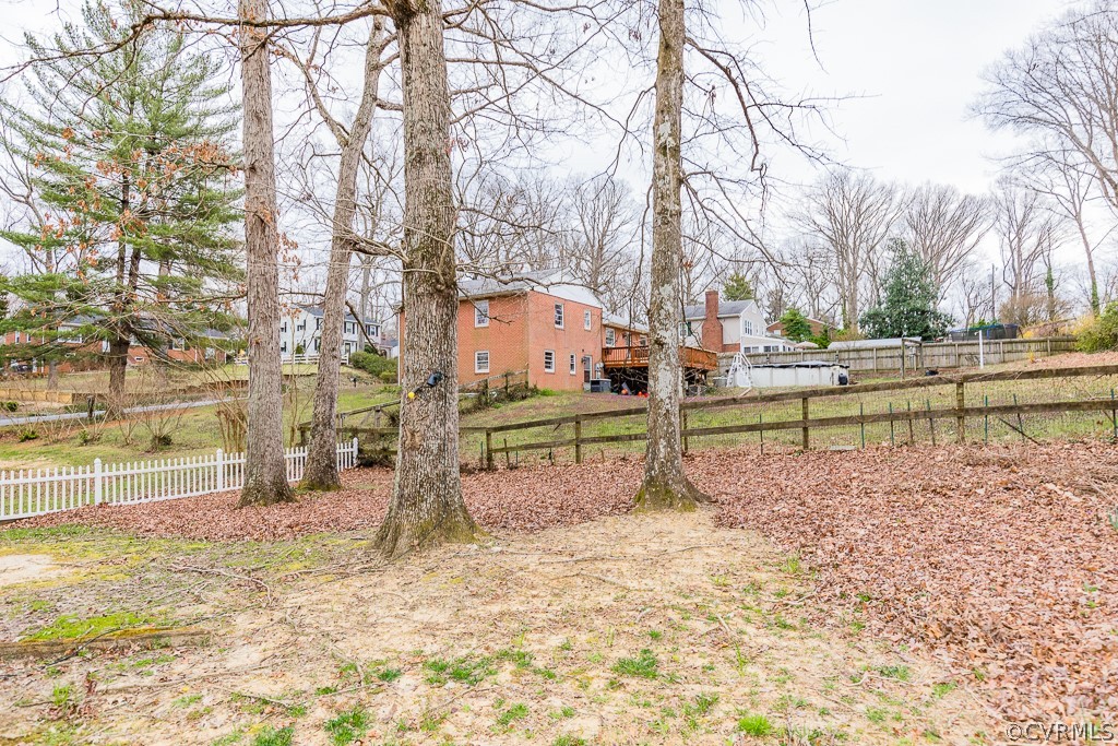 11301 Rolling Brook Road Chester, VA 23831 - Photo 7 of 49 a backyard of a house with lots of green space