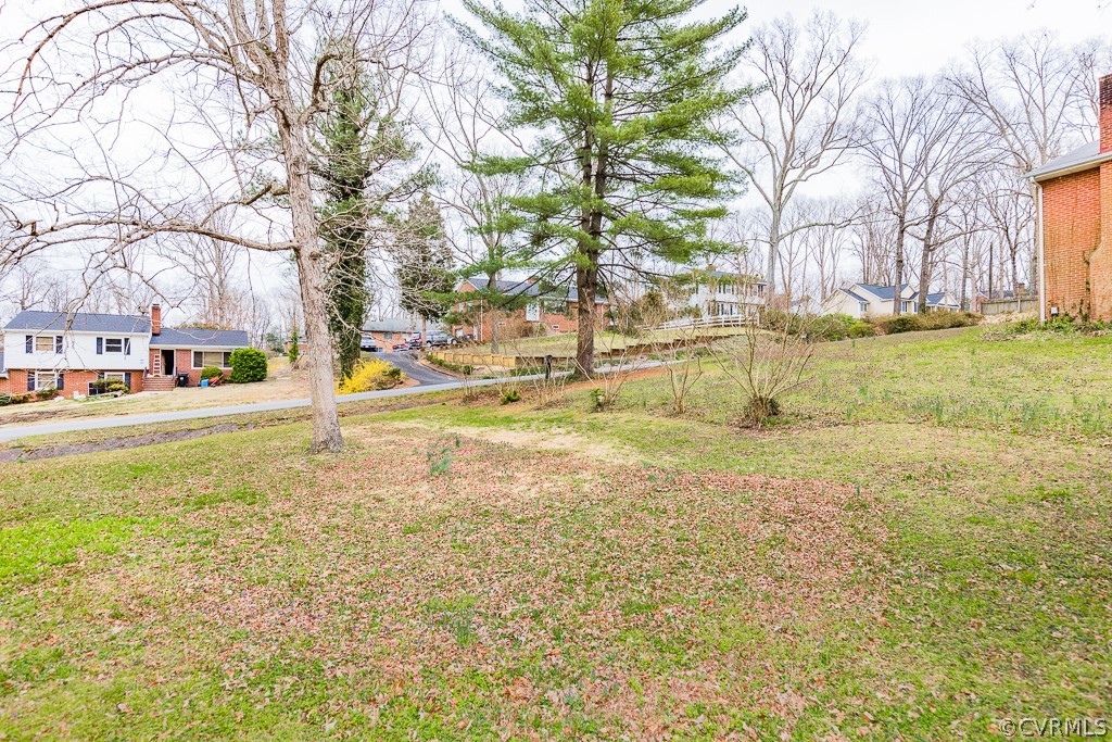 11301 Rolling Brook Road Chester, VA 23831 - Photo 8 of 49 a view of yard with swimming pool and trees