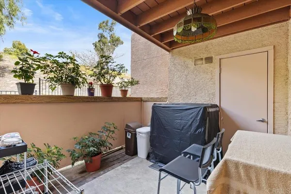 a view of balcony with furniture