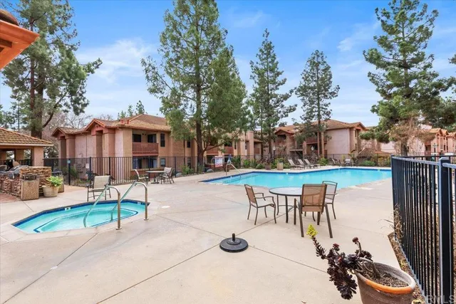 a view of a house with backyard porch and sitting area