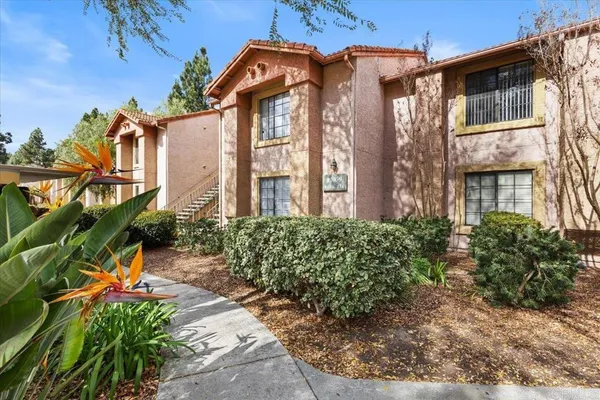 a view of a building with a garden