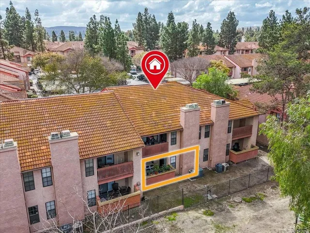 an aerial view of a house with a garden