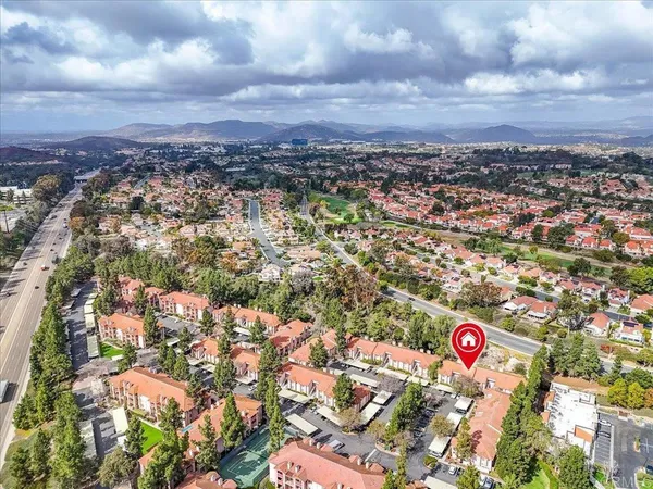 a view of swimming pool outdoor seating and city view