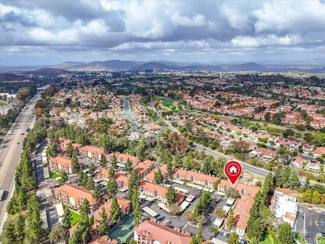a view of swimming pool outdoor seating and city view